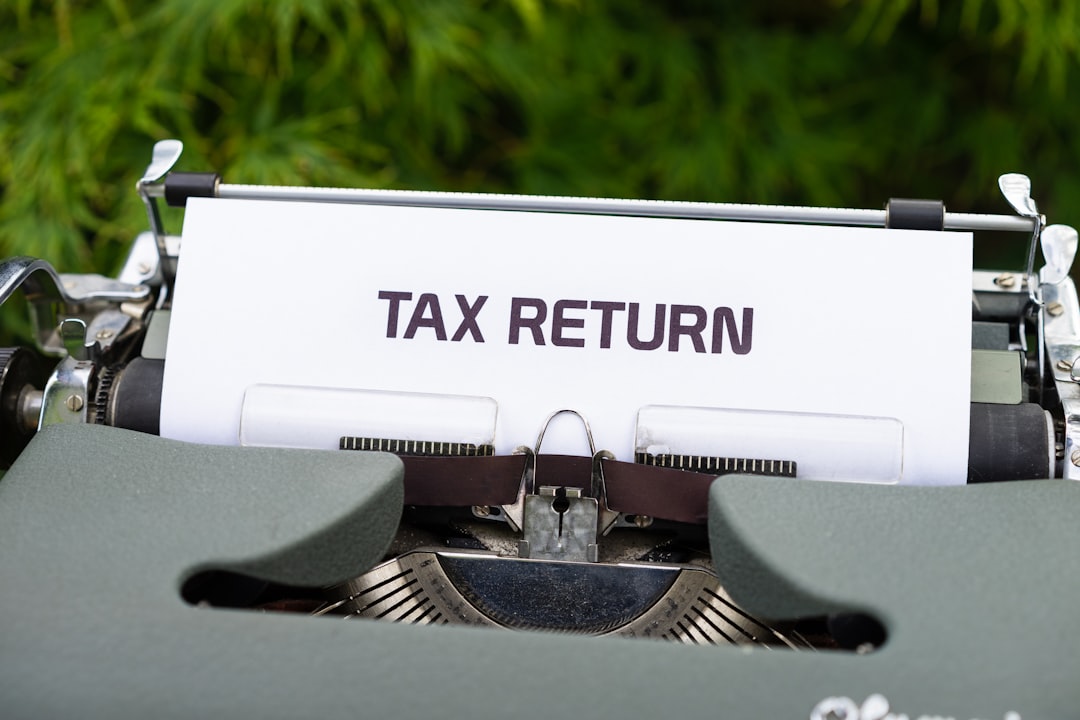 Person reviewing inherited IRA tax documents and withdrawal rules paperwork on desk