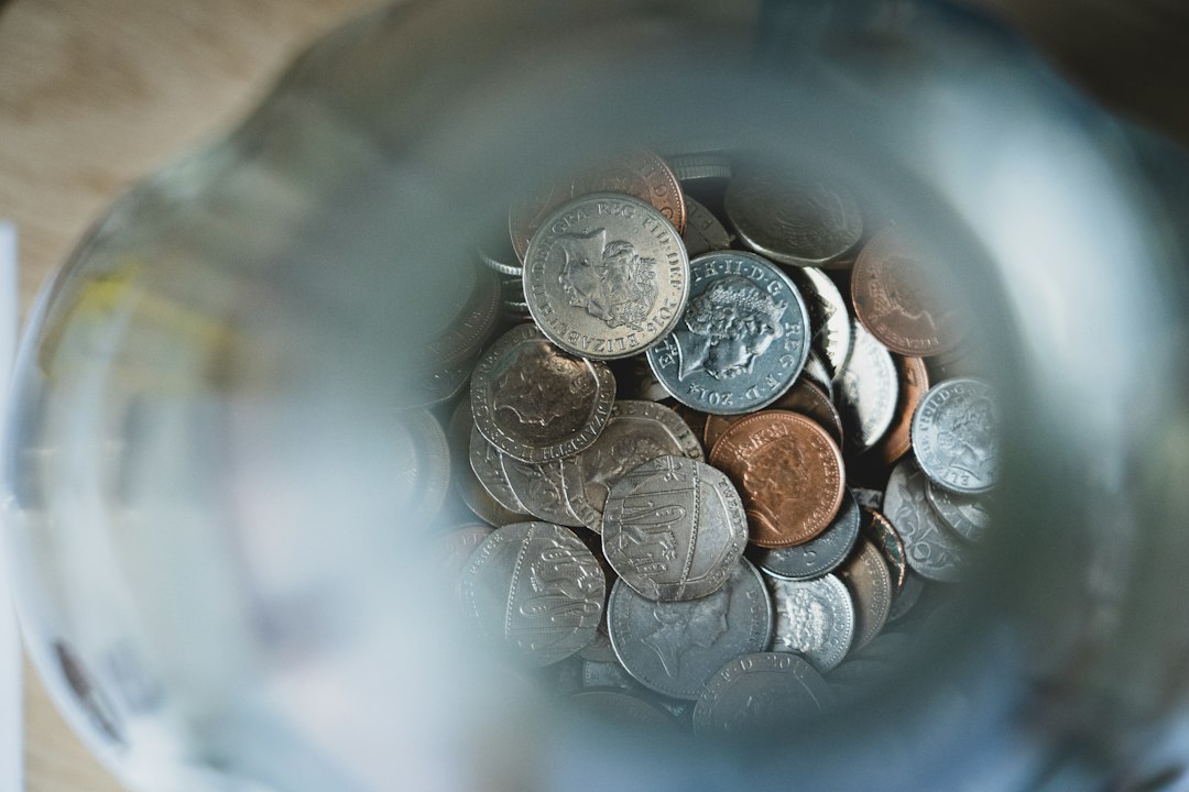 Young UK professional reviewing retirement savings charts and pension documents