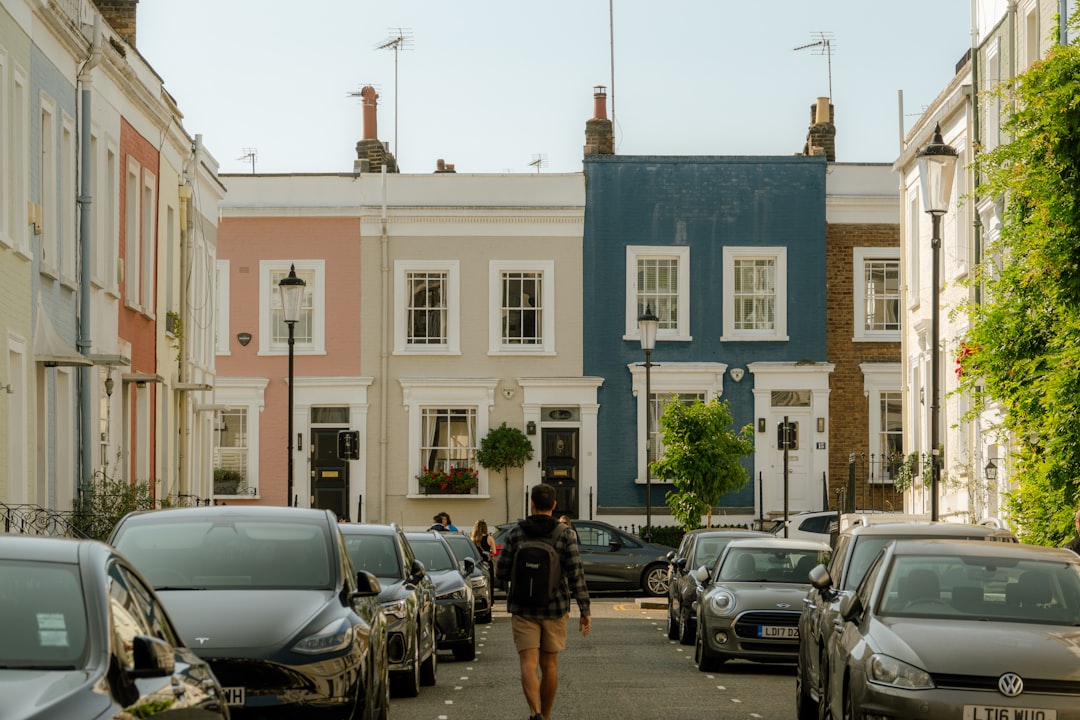 UK house model, calculator, and mortgage documents illustrating tracker mortgage rates