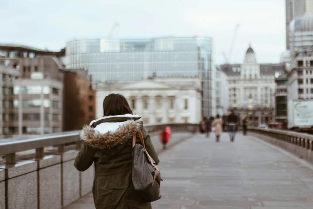 Checklist and magnifying glass over UK financial adviser credentials and paperwork