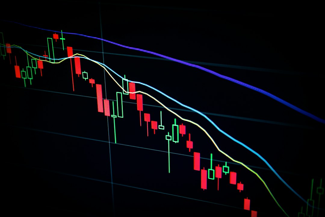 Stock market chart trending downward beside a clock, symbolizing recession investing timing