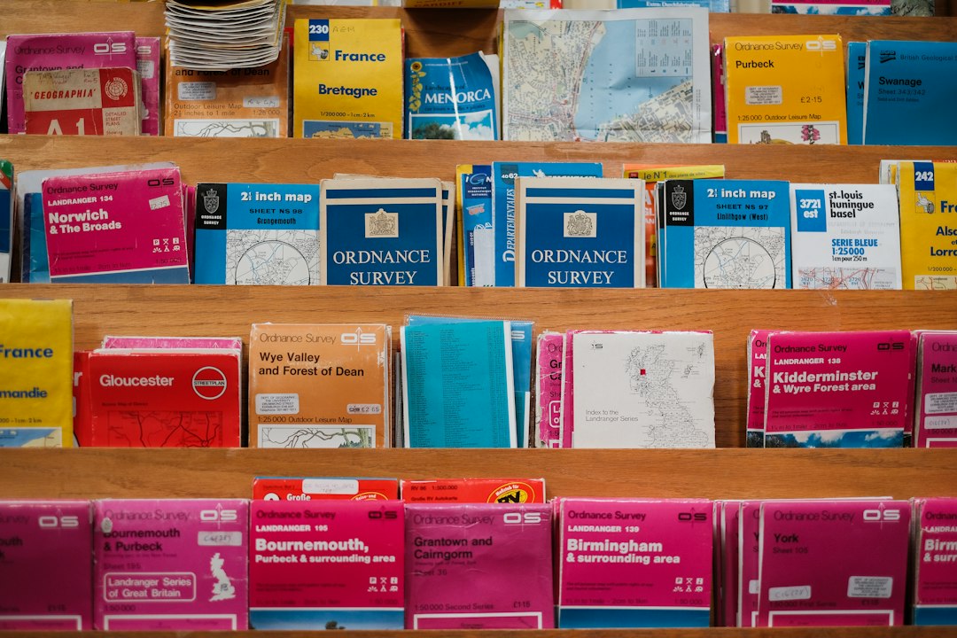 Pharmacist handing a prescription bag to a customer over a UK pharmacy counter
